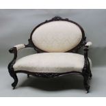 A 19TH CENTURY MAHOGANY SHOW WOOD FRAMED BOUDOIR TWO PERSON SETTEE, with carved crest, scrolling