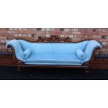 A WILLIAM IV PERIOD MAHOGANY SHOW WOOD FRAMED THREE PERSON SETTEE, having fancy carved central