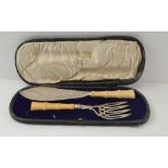 A CASED PAIR OF AESTHETIC DESIGN FISH SERVERS silver with carved ivory bamboo form handles, the