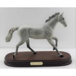 A BESWICK DAPPLE GREY RACEHORSE 'One Man' on polished wood base, overall 22cm high