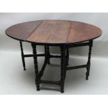 A LATE 18TH / EARLY 19TH CENTURY OAK OVAL TWIN FLAP GATELEG TABLE, on bobbin turned legs and