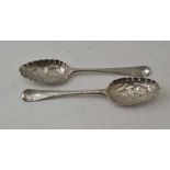 TWO 18TH CENTURY SILVER FRUIT SPOONS having embossed bowls, one visible hallmark, London 1752,