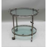 A MID-20TH CENTURY METAL FRAMED TWO-TIER DRINKS TROLLEY, the upper section being a lift-out twin