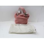 A CITRUS LADY'S HANDBAG, pink suede outer and pink ribbed satin lined and labelled, twin