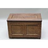 A PART 19TH CENTURY SMALL SIZED OAK BOX COFFER, with carved lift-up lid, plain panelled side and