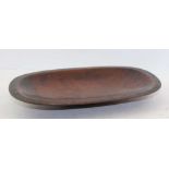 AN AFRICAN SHALLOW HARDWOOD BOWL, zig-zag decorated edge, 30cm x 19.5cm