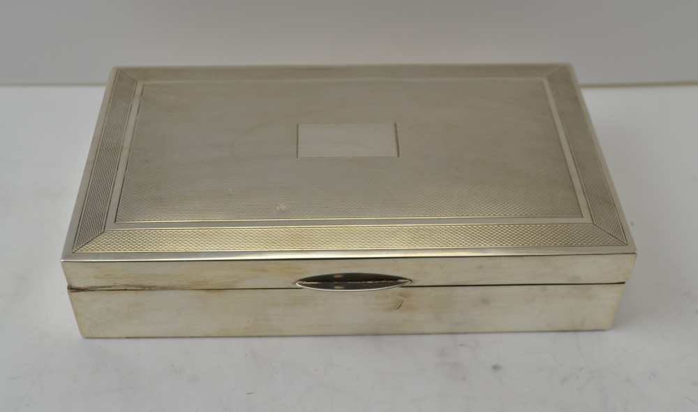 A 20TH CENTURY SILVER CIGARETTE BOX, engine turned hinged cover, cedar lined, Birmingham 1964,