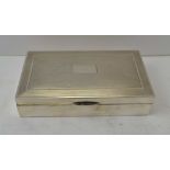 A 20TH CENTURY SILVER CIGARETTE BOX, engine turned hinged cover, cedar lined, Birmingham 1964,