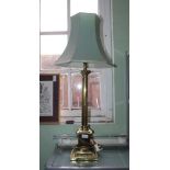 A CLASSICAL COLUMNED BRASS TABLE LAMP with shade