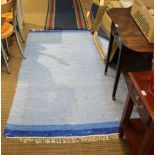 TWO MODERN WOVEN FLOOR RUGS both having blue ground