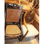 A LATE 19TH CENTURY STAINED BEECH FRAMED BERGERE ROCKING CHAIR