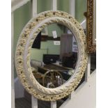 A FANCY CARVED & PIERCED OVAL PLAIN PLATE WALL MIRROR