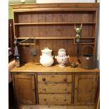 A PART 19TH CENTURY PINE DRESSER with later plate rack back, the base section having three central