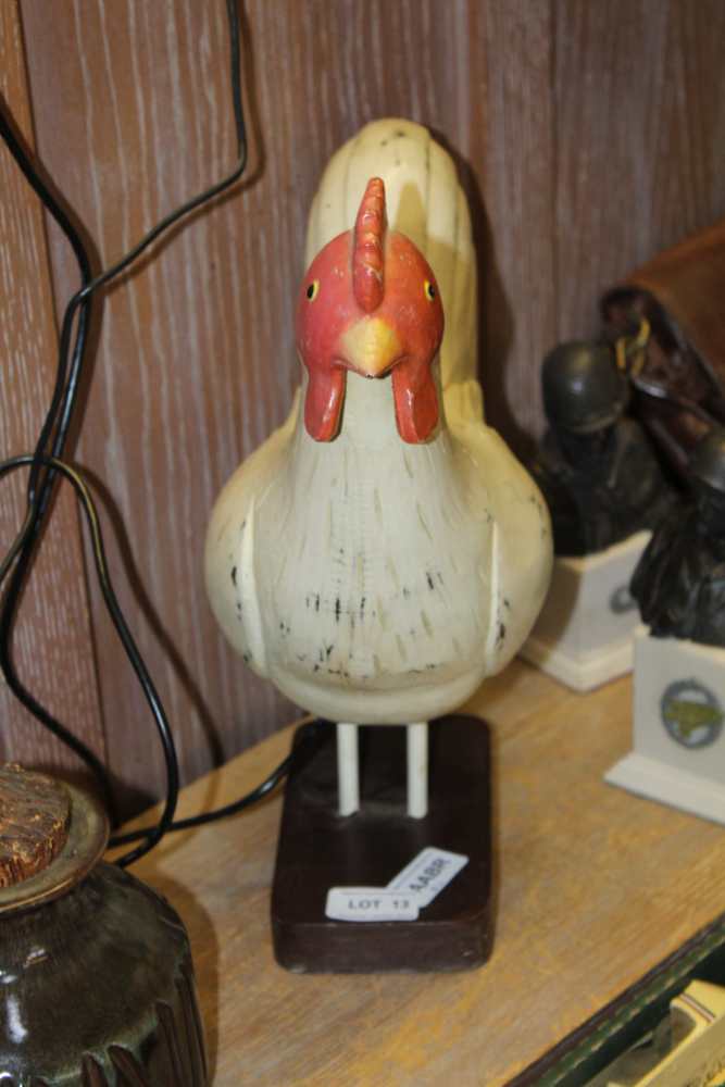 A PAINTED WOODEN MODEL CHICKEN