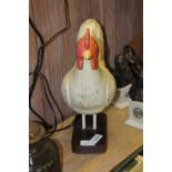 A PAINTED WOODEN MODEL CHICKEN