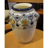A LARGE CONTINENTAL POTTERY TWIN HANDLED JAR, having hand painted banding of fruit