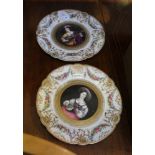 A PAIR OF CONTINENTAL CERAMIC CABINET PLATES, each with a central painted musician within a floral