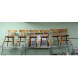 A SET OF SIX BLONDE WOOD SPINDLE BACK SOLID SEATED KITCHEN CHAIRS