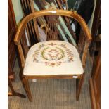 AN EDWARDIAN HORSESHOE BACKED SINGLE CHAIR with fancy pierced slats, and floral wool work pad seat