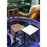 A METAL TROLLEY, together with A RECTANGULAR PAD TOPPED STOOL on black finished ironwork frame,