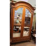 A REPRODUCTION FRENCH WALNUT FINISHED TWO DOOR ARMOUR with inset bevel plate mirror panels, the base
