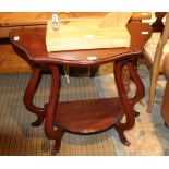 A MODERN MAHOGANY FINISHED DEMI-LUNE TWO TIER CONSOLE TABLE together with a bergere backed armchair