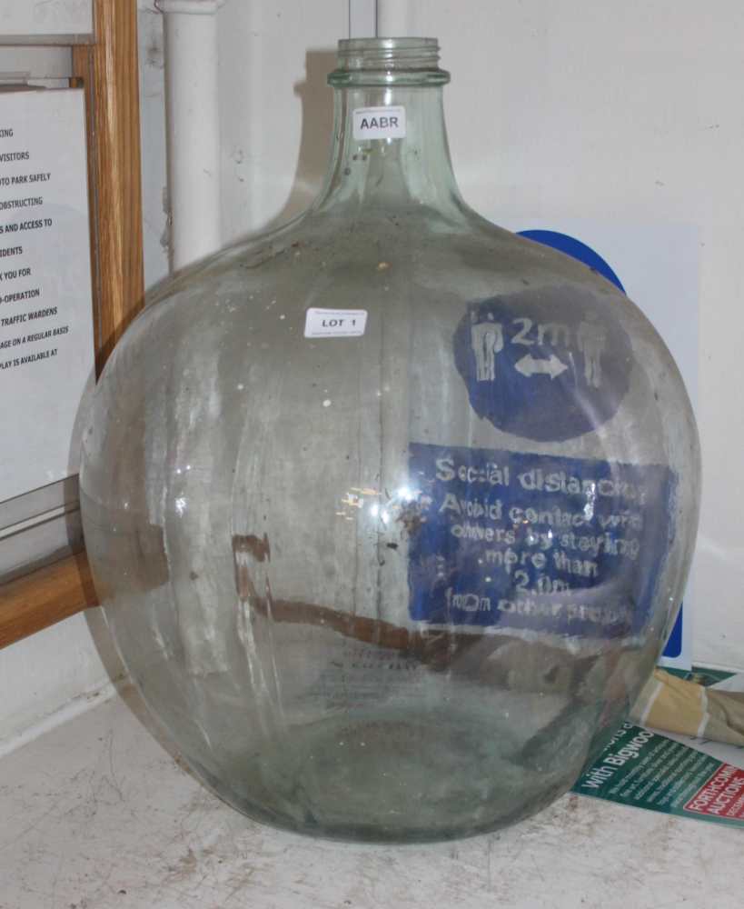 A TYPICAL MID-CENTURY GLASS CARBOY