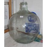 A TYPICAL MID-CENTURY GLASS CARBOY