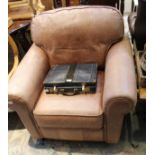 A DISTRESSED MUSTANG LEATHER UPHOLSTERED DEEP SEATED ARMCHAIR