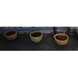 A TRIO OF RIBBED TERRACOTTA GARDEN PLANTERS