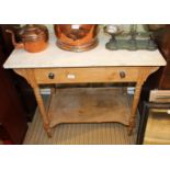A LATE 19TH / EARLY 20TH CENTURY PINE BASED WASHSTAND with plain marble top