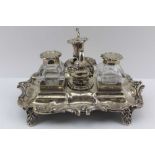 HENRY WILKINSON & CO., A WILLIAM IV TWO BOTTLED SILVER STANDISH INKSTAND with central taperstick and