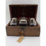 A SET OF THREE MID 18TH CENTURY SILVER LIDDED FACET CUT GLASS TEA CADDIES, the central box form, the