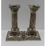 MARTIN HALL& CO. A PAIR OF VICTORIAN SILVER CANDLESTICKS, of Corinthian column form, the bases