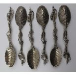 A SET OF SIX LATE 19TH CENTURY WHITE METAL NOVELTY TEASPOONS, cast with leaf form bowls, the
