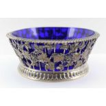 PAIRPOINT BROTHERS, A SILVER BASKET with gadrooned rim, applied with repousse fruiting vine in the