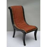 A LATE 19TH CENTURY EBONISED & BRASS FRAMED SLIPPER TYPE NURSING CHAIR, with one piece striped