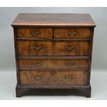 A LATE 18TH CENTURY PINE CARCASED CHEST OF FIVE DRAWERS with walnut fronts, two inline over three