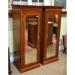 A PAIR OF PROBABLE EARLY 20TH CENTURY MAHOGANY FINISHED SINGLE MIRROR DOORED WARDROBES, each