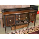A LARGE FIRST QUARTER 20TH CENTURY MAHOGANY FINISHED SIDEBOARD, having blind fret carved upstand,