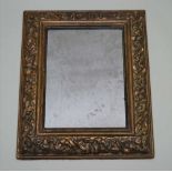 A FRENCH MID 19TH CENTURY MOULDED PAPIER-MACHE FRAME with remains of original gilding, currently