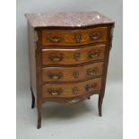 A LATE 19TH CENTURY FRENCH DESIGN SERPENTINE FRONTED FOUR DRAWER CHEST, having polished rouge marble
