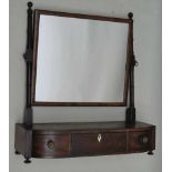 A 19TH CENTURY MAHOGANY FINISHED ADJUSTABLE RECTANGULAR PLAIN PLATE DRESSING TABLE MIRROR, on ring