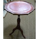 A REPRODUCTION PIE CRUST EDGE WINE TABLE with red skiver insert top