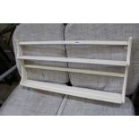 A LATE PAINTED ERCOL SET OF WALL HANGING SHELVES