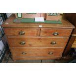 A LATE 19TH CENTURY STRIPPED PINE FOUR DRAWER CHEST, supported on squashed bun feet