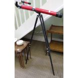 A TASCO BRANDED CELESTIAL TELESCOPE on tripod stand