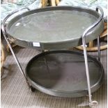 AN ART DECO DESIGNED CHROME FRAMED TWO TIER OVAL SERVING TROLLEY