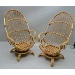 FOUR LATE 20TH CENTURY ANGRAVES BRANDED INVINCIBLE BAMBOO ARMCHAIRS, on swivelled four legged