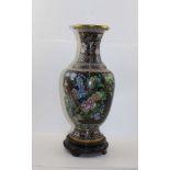 A CHINESE CLOISONNE VASE of baluster form, decorated with exotic birds & flowers on a noir ground,